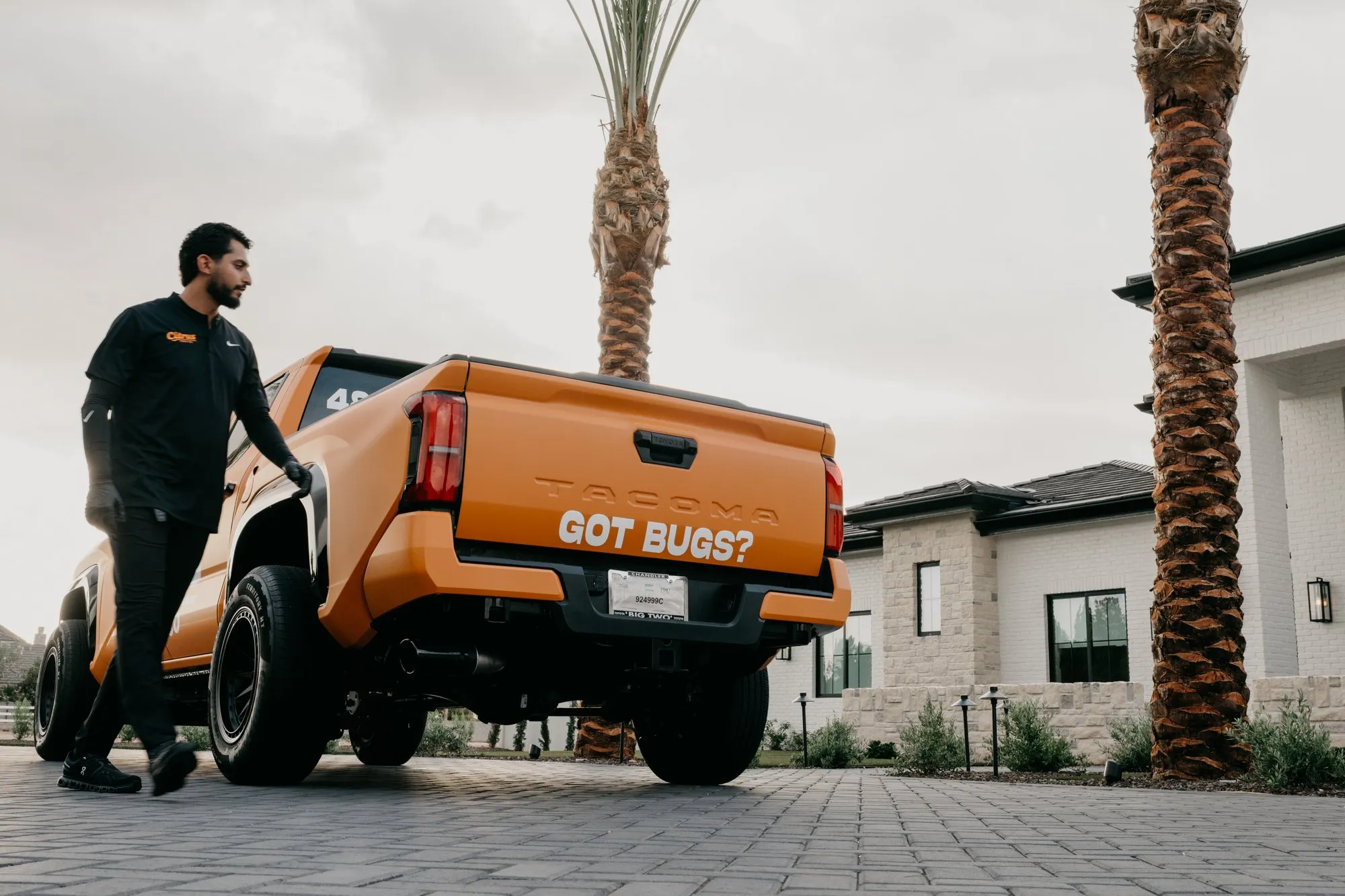 The Citrus Pest Co truck with a Got Bugs tailgate parked at an East Valley home